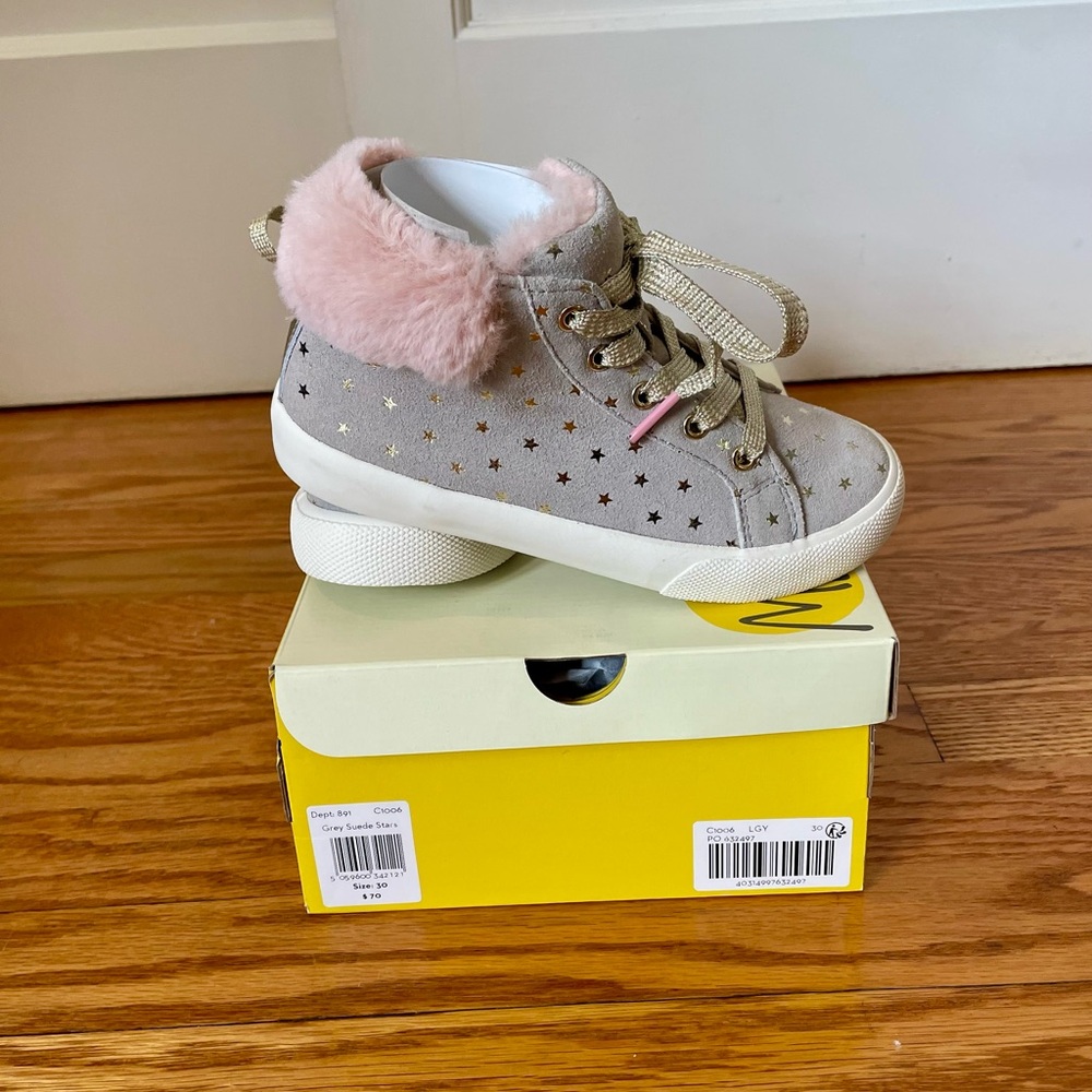 Mini Boden star high top shoes.